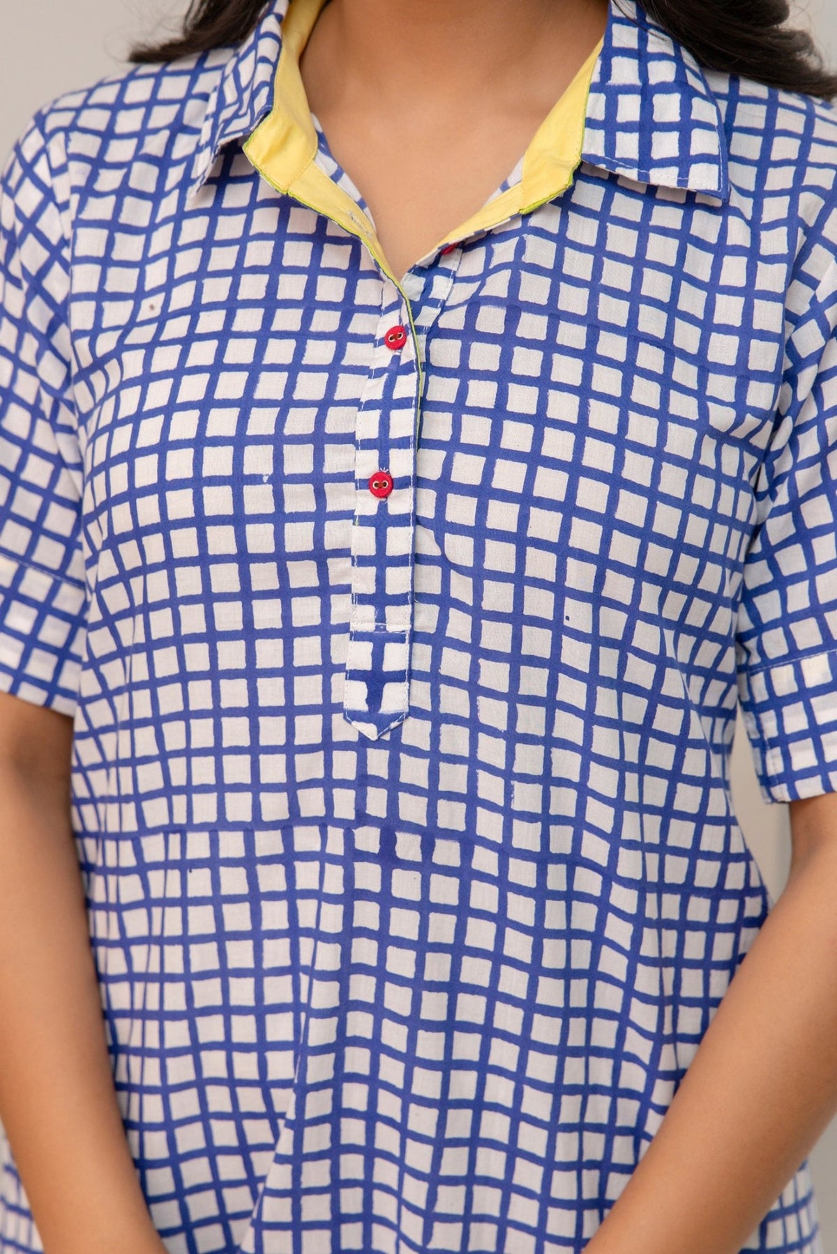 Close-up of blue and white hand block checkered print on cotton