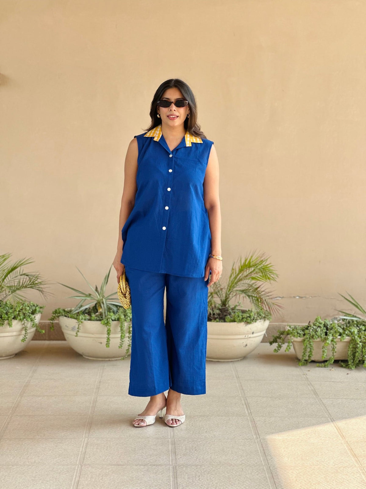 Sleeveless blue cotton collared top with yellow check detailing