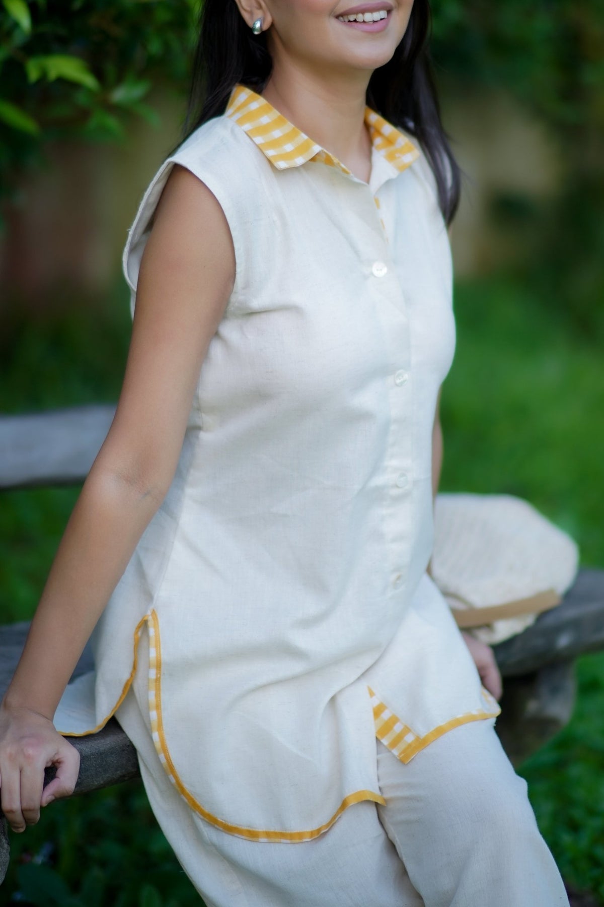 Yellow checkered piping on hem of cream cotton co-ord set